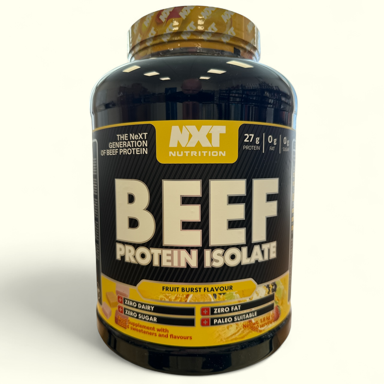 Fruit Burst Beef protein isolate container with NXT Nutrition branding on a white background