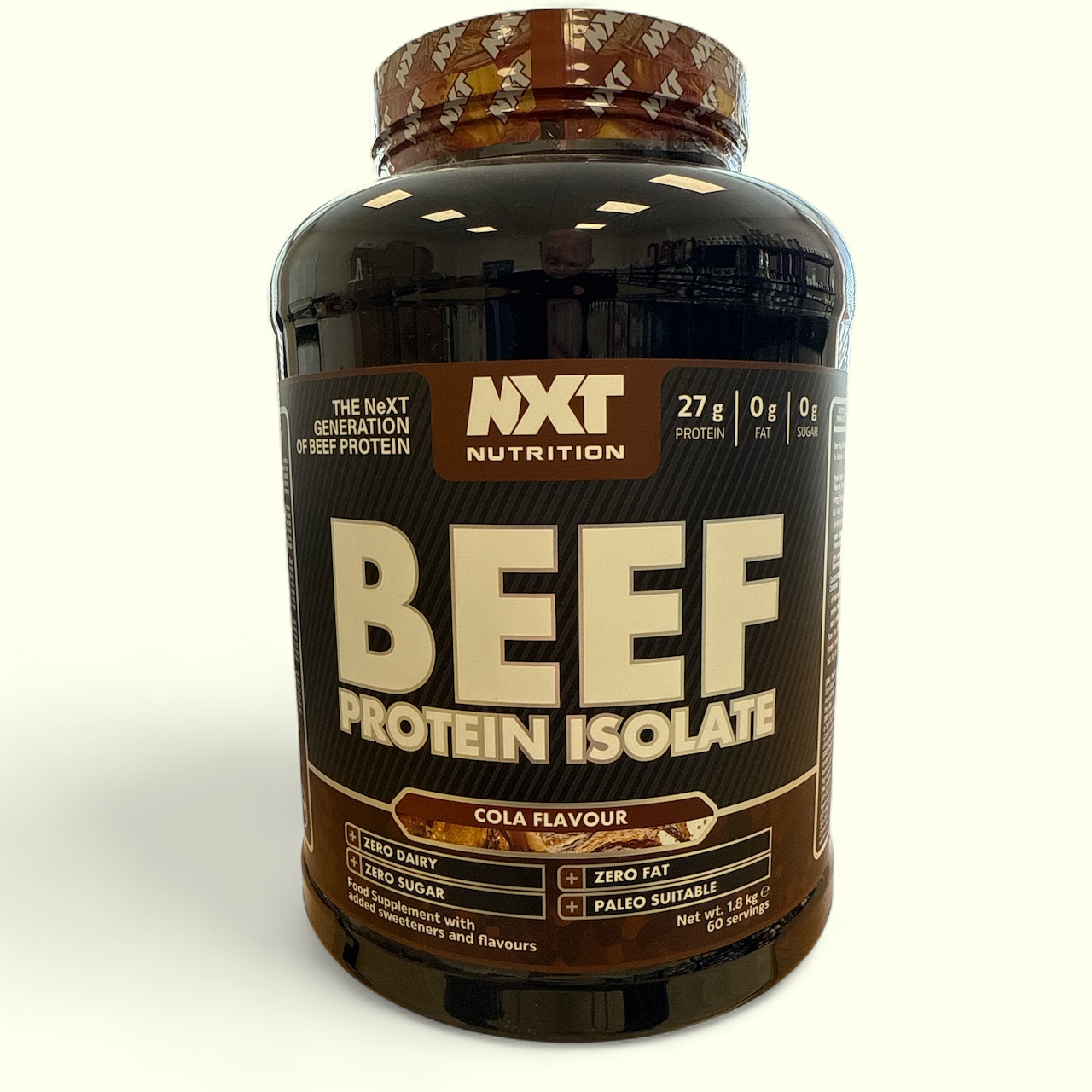 NXT Nutrition Beef Protein Isolate bottle with cola flavour on a white background
