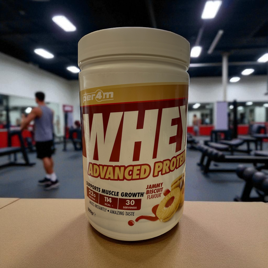 Whey protein powder container on a table in a gym setting