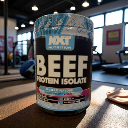 NXT Nutrition Beef Protein Isolate container in a gym setting ice blast flavour