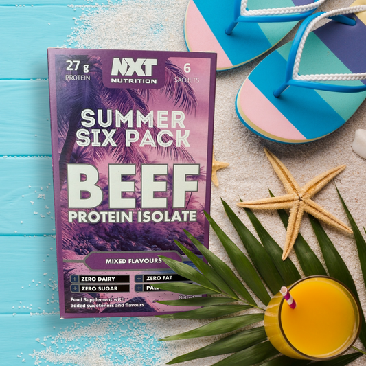 NXT Nutrition Summer Six Pack Beef Protein Isolate package on a beach setting with flip-flops and a drink.
